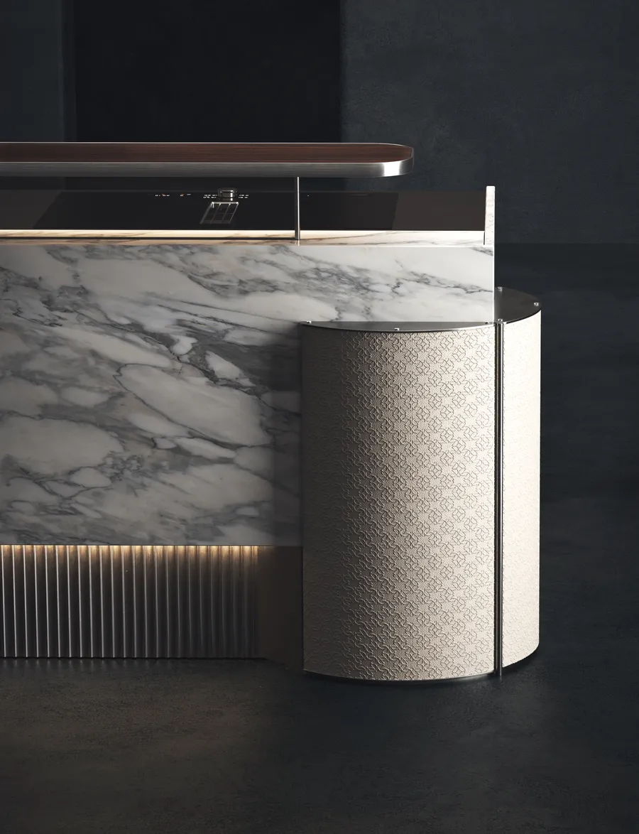 ELIE SAAB Maison island in Calacatta marble beside a pressed leather column
