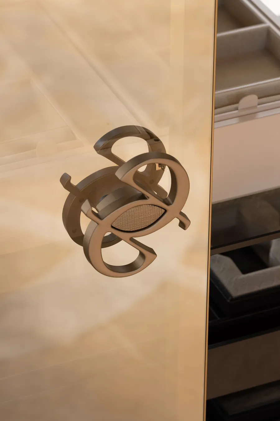ELIE SAAB monogram handle on a bronze glass door