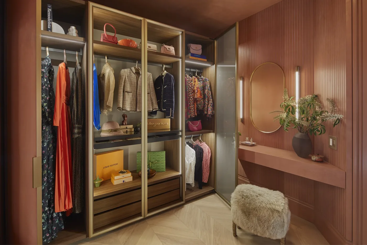 Her Closet wardrobe wall with bronze glass doors and integrated lighting