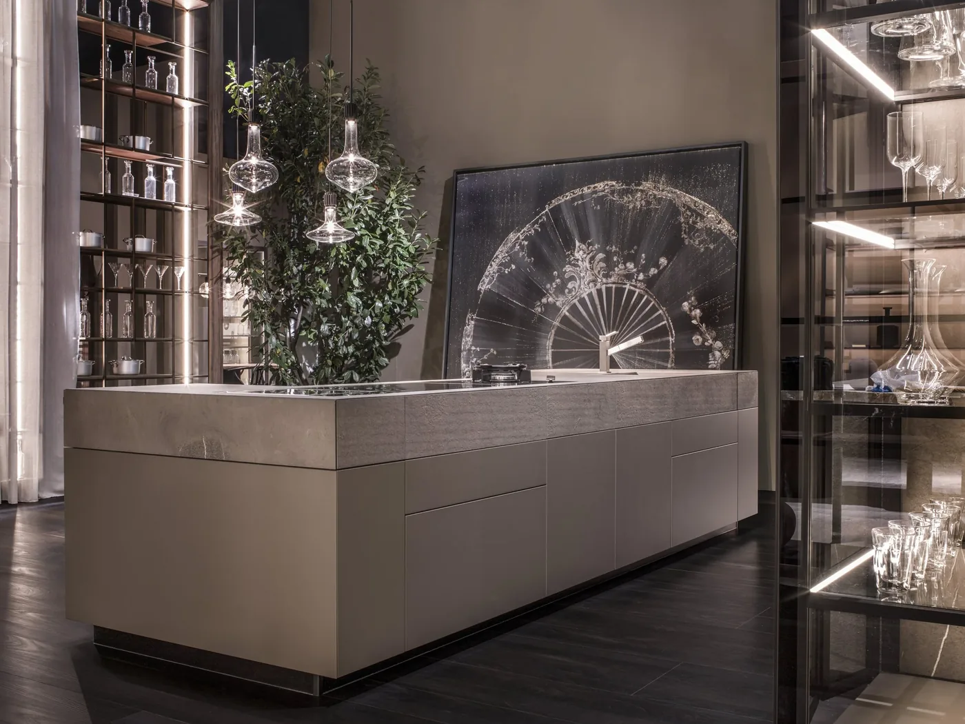 Monolite island with illuminated glass display cabinetry