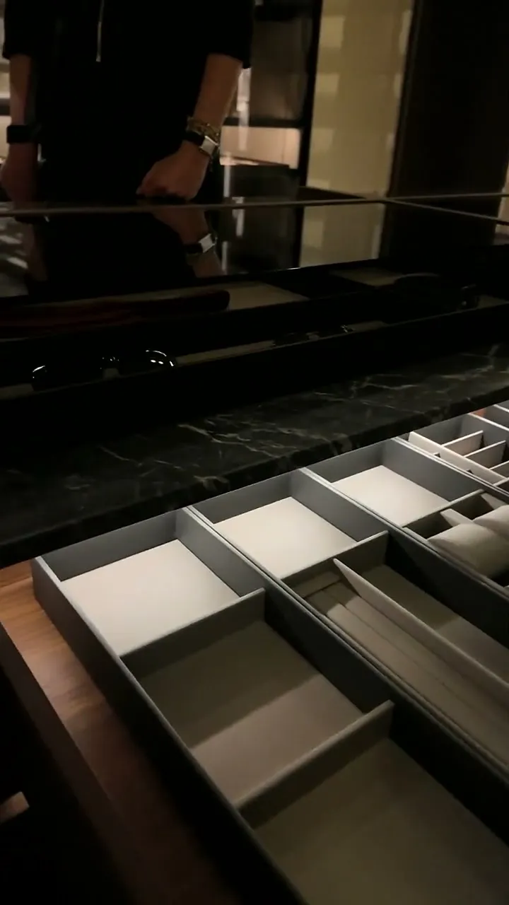 Glass-top drawers in a dressing island