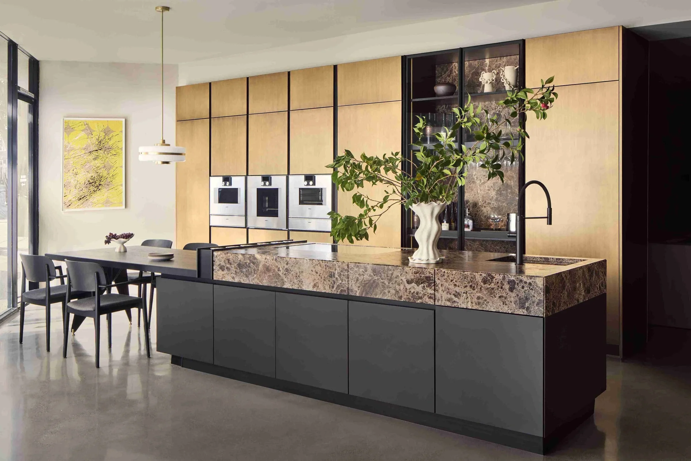 SCIC kitchen at the San Francisco showroom with a framed yellow artwork on the dining wall