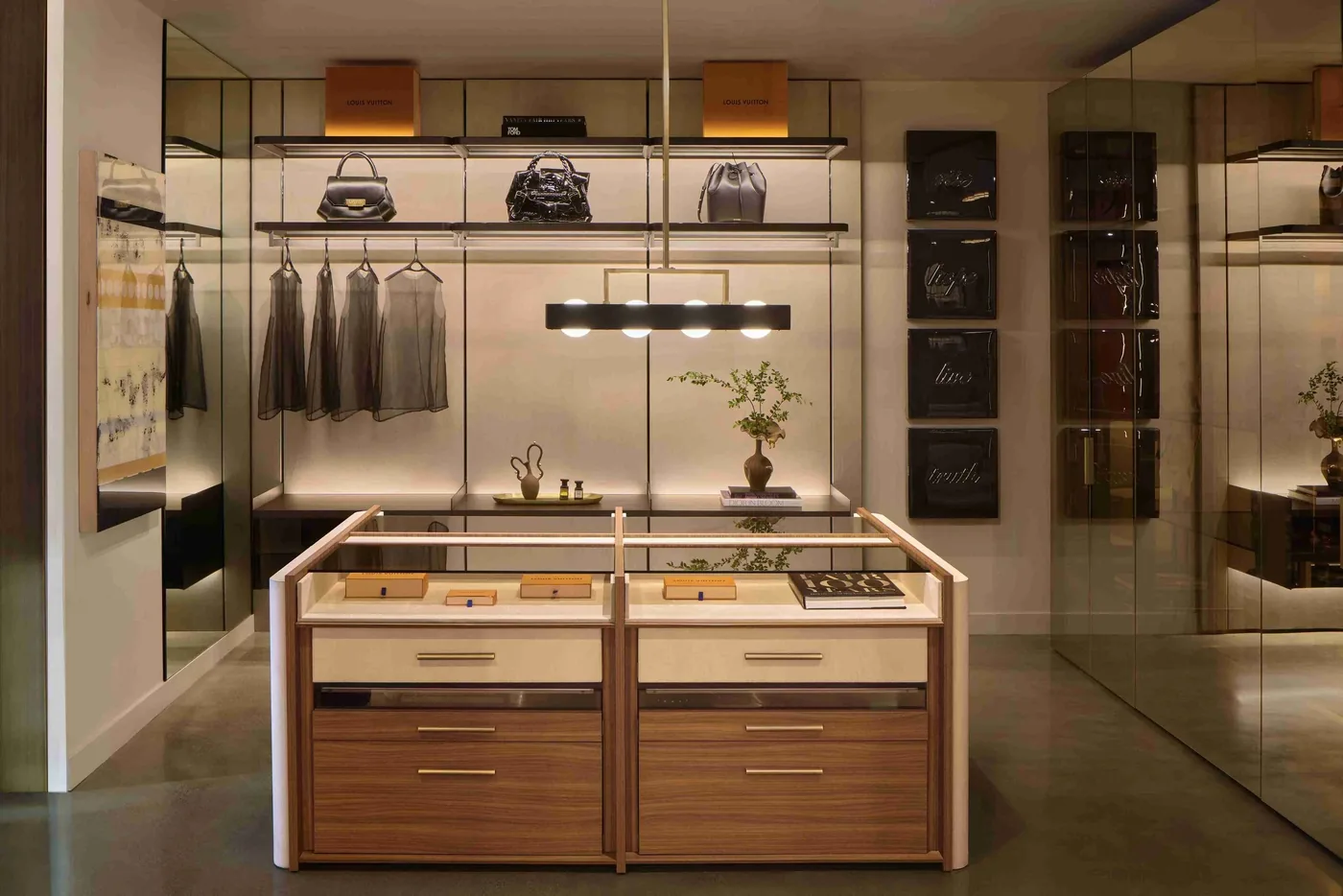 Walk-in closet island with glass-top display drawers at the SCIC San Francisco showroom